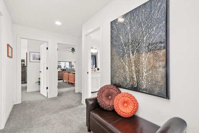 living area featuring light colored carpet