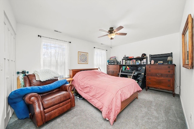 bedroom with light carpet and ceiling fan