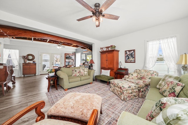 living room featuring a healthy amount of sunlight, hardwood / wood-style floors, ceiling fan, and french doors