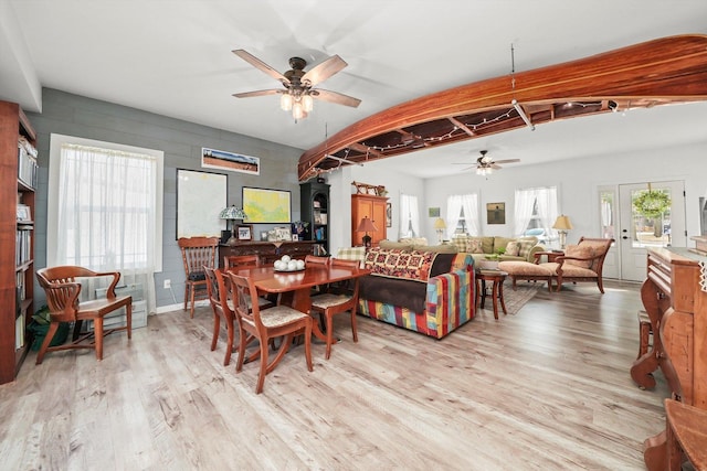 dining area with ceiling fan and light hardwood / wood-style floors