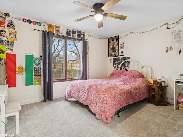 bedroom with carpet, baseboards, and a ceiling fan