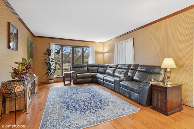 living area featuring ornamental molding, light wood-type flooring, and wallpapered walls