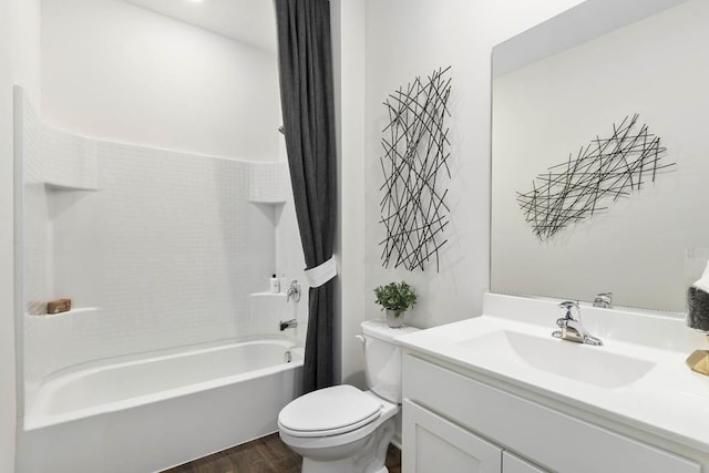 full bathroom with vanity, hardwood / wood-style floors, shower / bathtub combination with curtain, and toilet