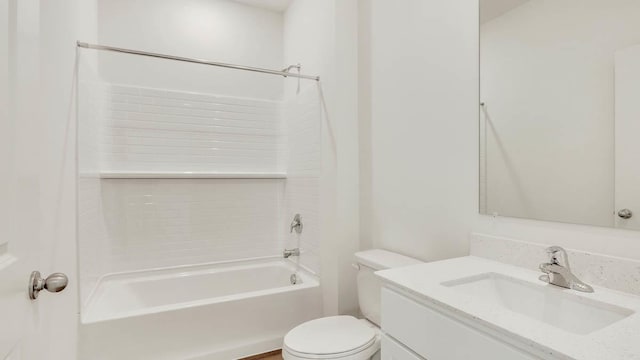 full bathroom featuring toilet, vanity, and bathtub / shower combination