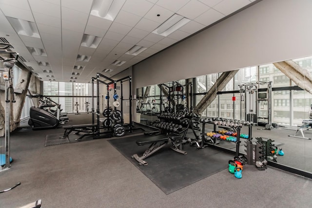 exercise room featuring a drop ceiling