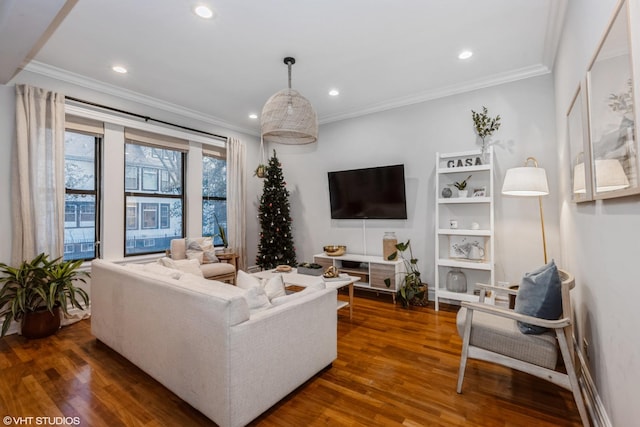 living room with dark hardwood / wood-style flooring and crown molding