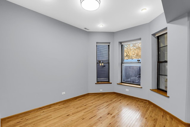 spare room featuring light wood-type flooring