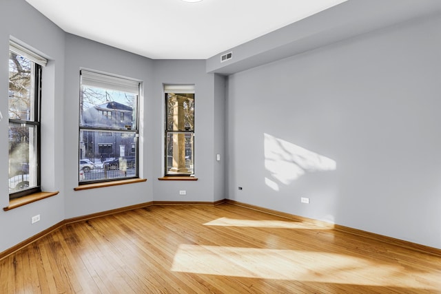 empty room with wood-type flooring