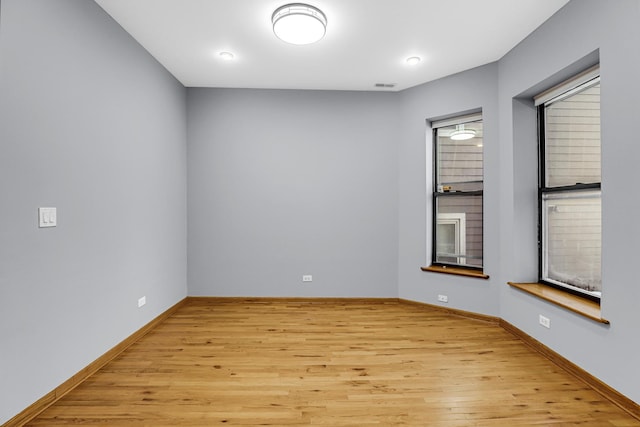 spare room featuring light wood-type flooring