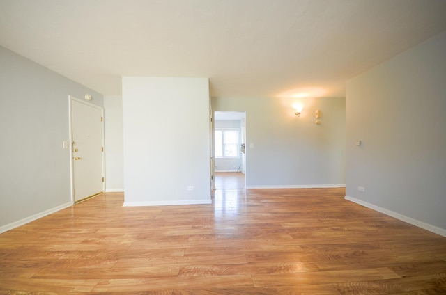 spare room featuring light hardwood / wood-style flooring