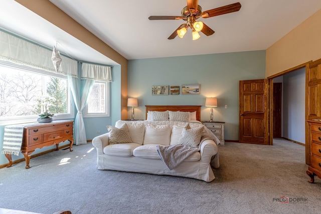 carpeted bedroom with baseboards and ceiling fan