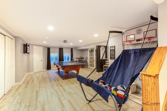 recreation room featuring recessed lighting, crown molding, baseboards, and wood finished floors