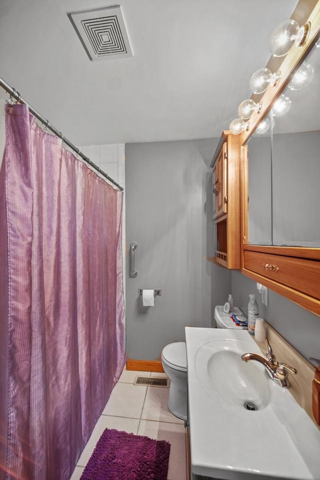 bathroom with tile patterned floors, visible vents, toilet, and vanity