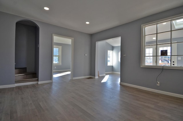 empty room with hardwood / wood-style floors