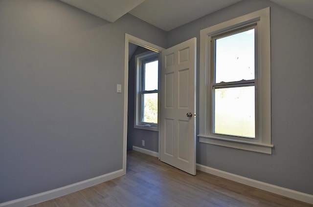 spare room featuring light hardwood / wood-style floors