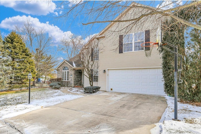 traditional-style house with driveway and an attached garage