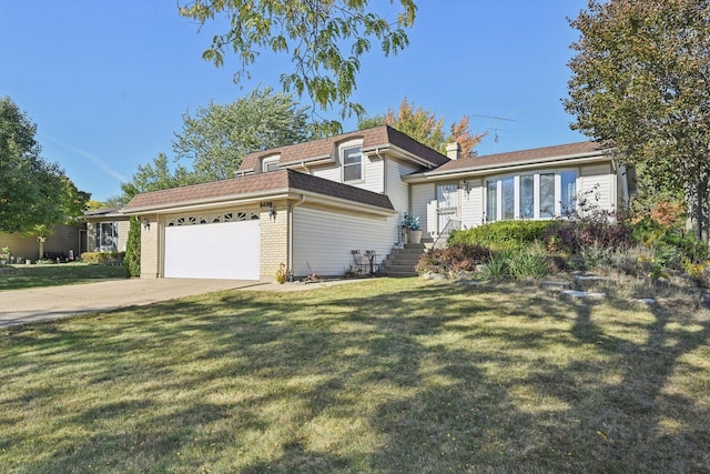 tri-level home with a garage and a front yard