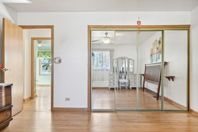 interior space with light hardwood / wood-style floors and a closet