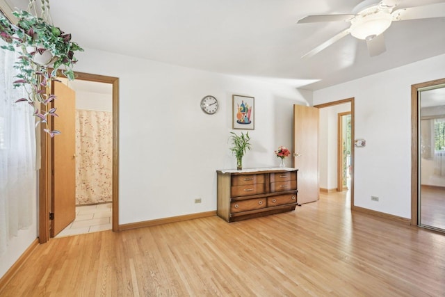 unfurnished room featuring ceiling fan and light wood-type flooring