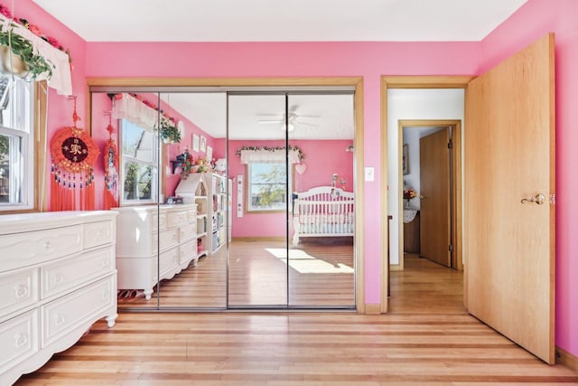 bedroom featuring a closet and light wood-type flooring