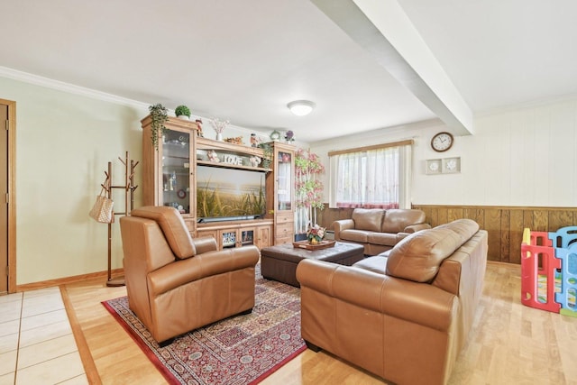 living room with hardwood / wood-style floors and crown molding