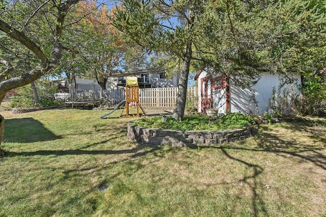 view of yard featuring a playground and a trampoline