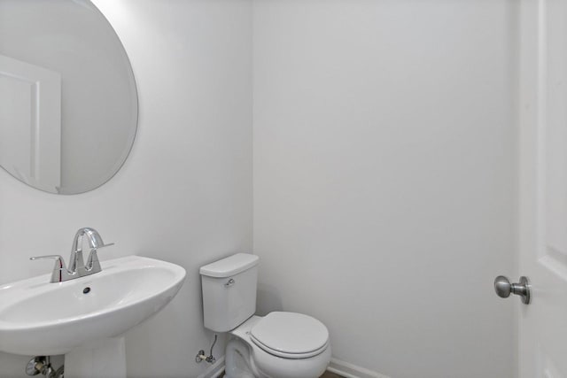 bathroom with sink and toilet