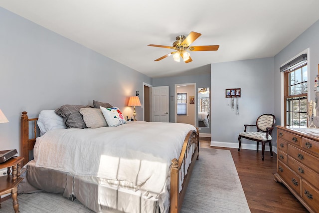 bedroom with ceiling fan and dark hardwood / wood-style flooring