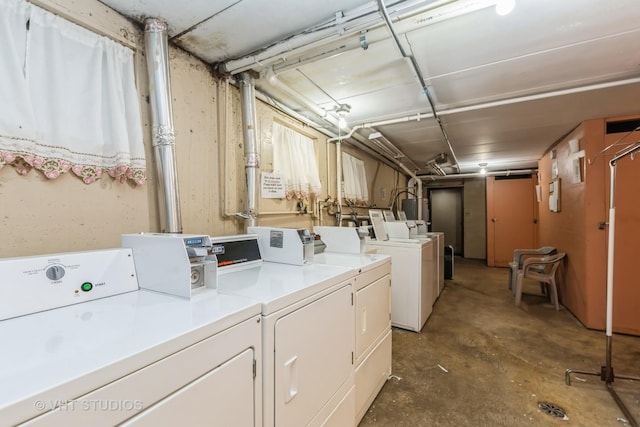 laundry room featuring separate washer and dryer and water heater