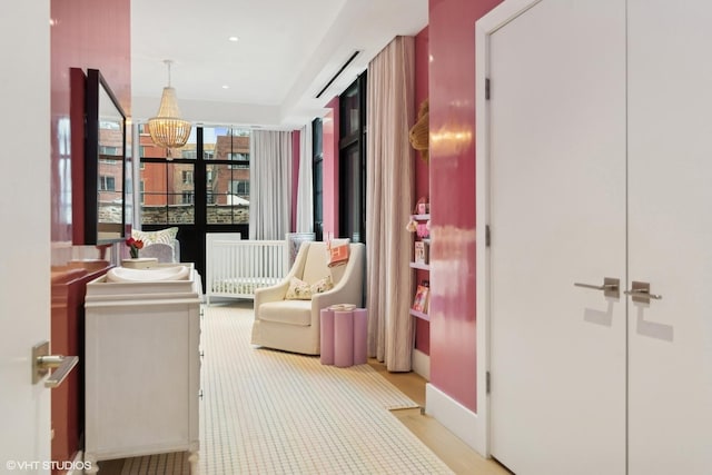 hallway with an inviting chandelier