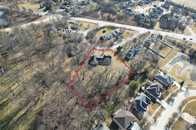 birds eye view of property with a residential view