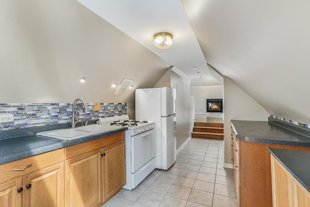 kitchen with white appliances, decorative backsplash, dark countertops, a sink, and light tile patterned flooring