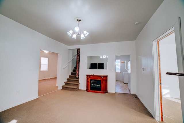 unfurnished living room with carpet floors, stairs, baseboards, and a fireplace