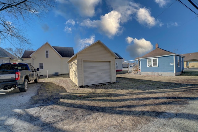 exterior space featuring driveway and an outdoor structure