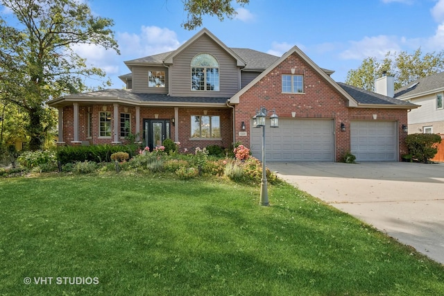 15610 116th Ave, Orland Park, IL 60467 - view of front facade with a garage, a front yard, and a porch