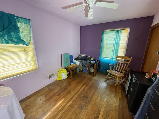 interior space featuring hardwood / wood-style flooring, plenty of natural light, and ceiling fan