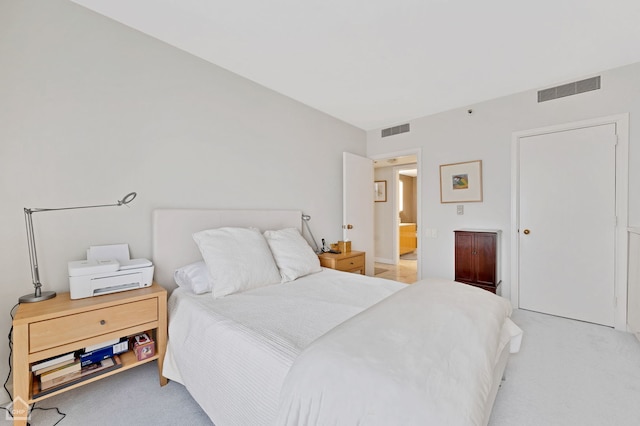 bedroom featuring light colored carpet