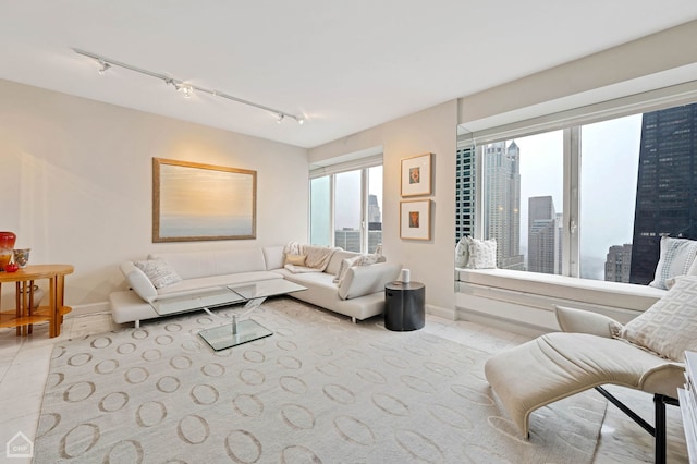 living room featuring light tile patterned floors and track lighting