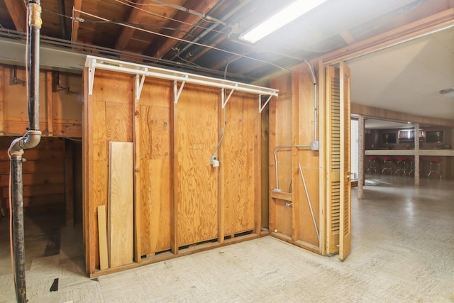 finished basement with tile patterned floors