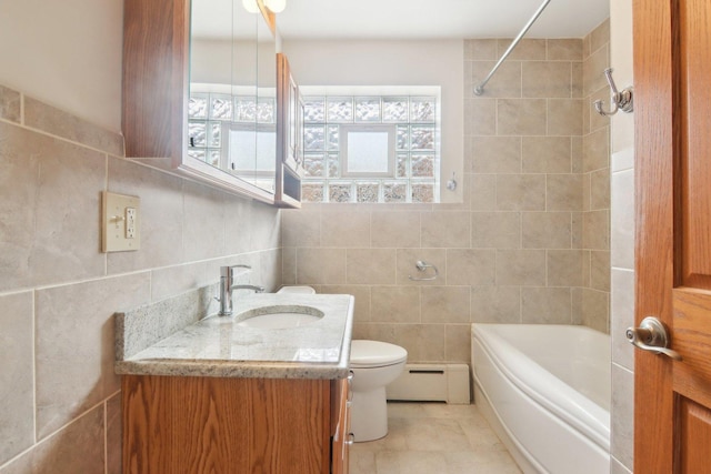 bathroom featuring a baseboard radiator, toilet, tile walls, and vanity