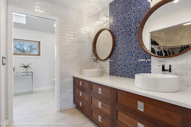 15022 S Woodcrest Ave, Homer Glen, IL 60491 - bathroom with double vanity, decorative backsplash, and tile patterned flooring