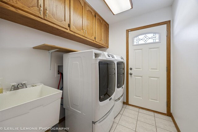 15022 S Woodcrest Ave, Homer Glen, IL 60491 - washroom with washing machine and clothes dryer, cabinet space, and light tile patterned flooring