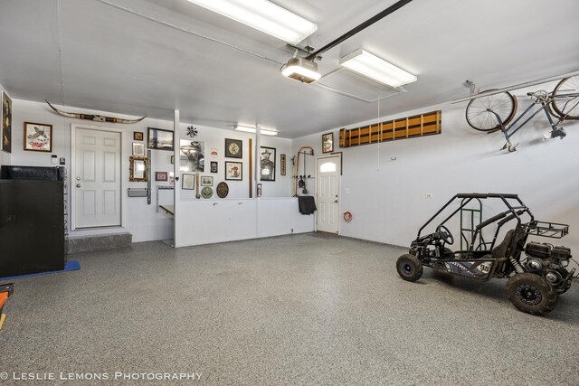 15022 S Woodcrest Ave, Homer Glen, IL 60491 - garage with covered porch and a garage door opener