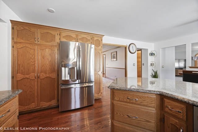 15022 S Woodcrest Ave, Homer Glen, IL 60491 - kitchen with stainless steel fridge with ice dispenser, dark wood-type flooring, light stone counters, and brown cabinets