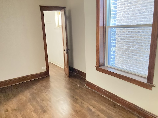 empty room featuring wood-type flooring