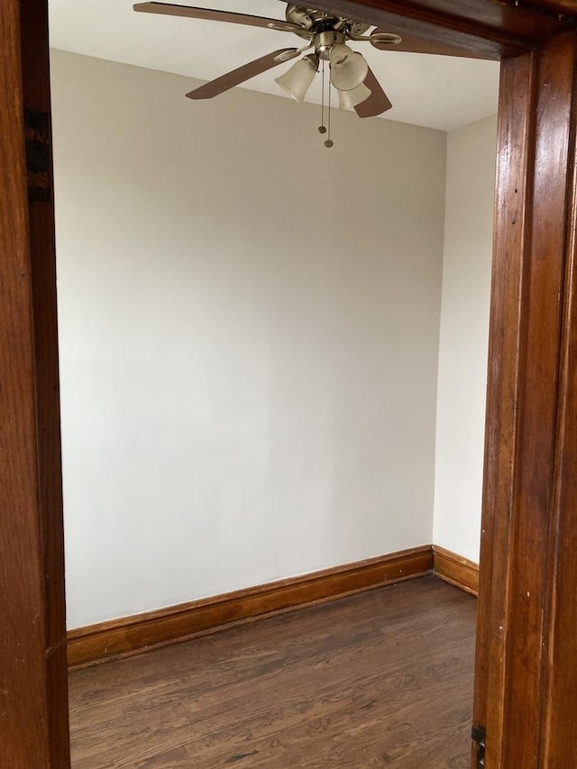 unfurnished room featuring ceiling fan and dark hardwood / wood-style flooring