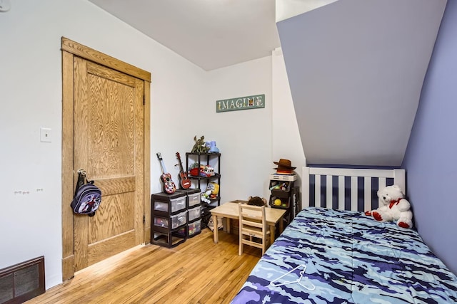 bedroom with wood-type flooring