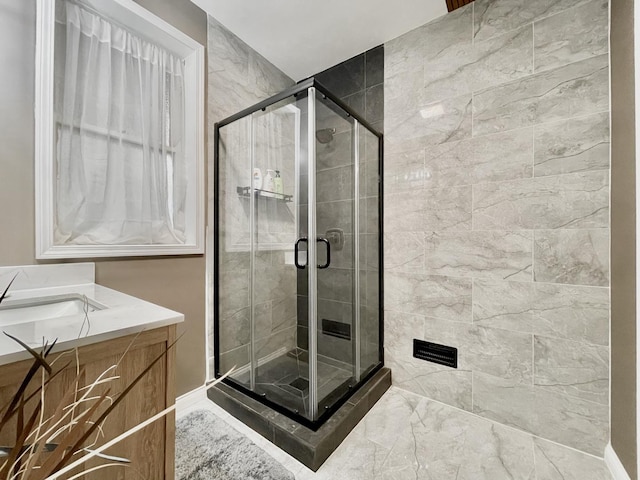 bathroom featuring vanity and an enclosed shower