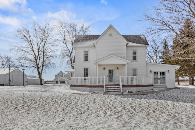 rear view of house featuring french doors and a wooden deck