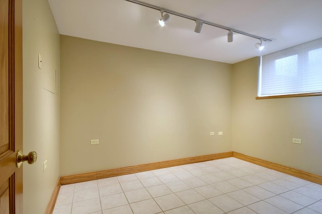 unfurnished room featuring baseboards